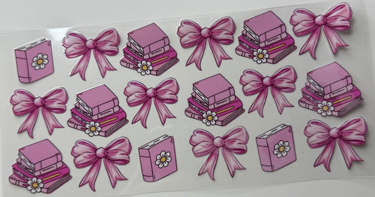 Pink bow and books