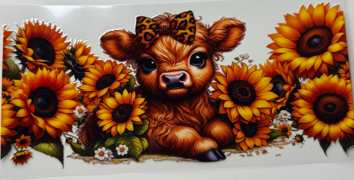 Cow and sunflowers